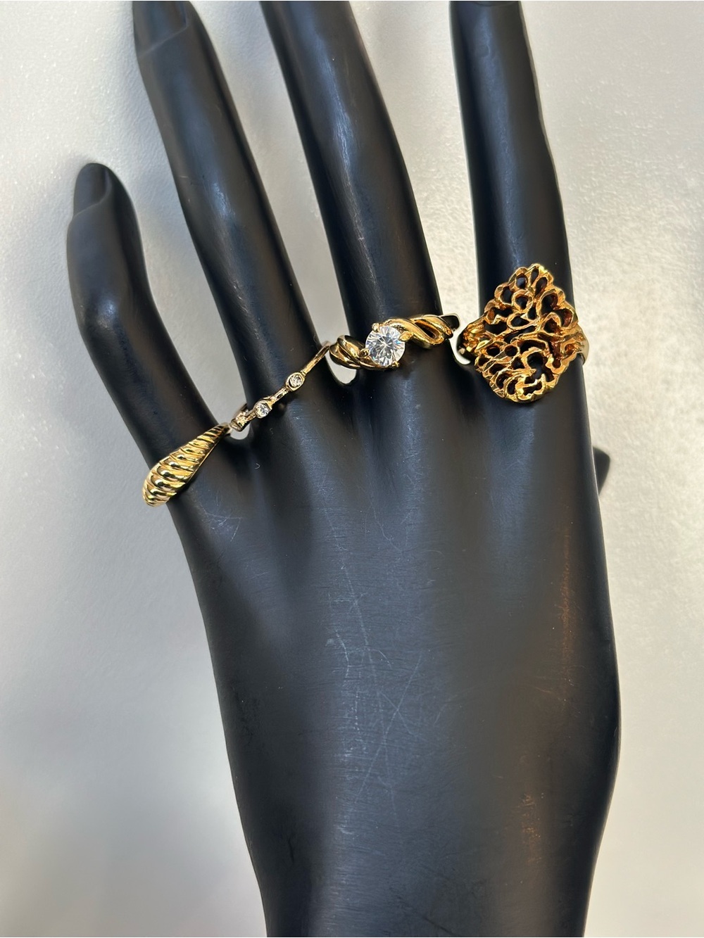 Gold-Tone Filigree and Crystal Accent Rings Lot of four costume Jewery
